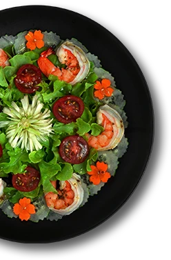 Shrimps salad with vegetables healthyfood dish decorate with carved carrot